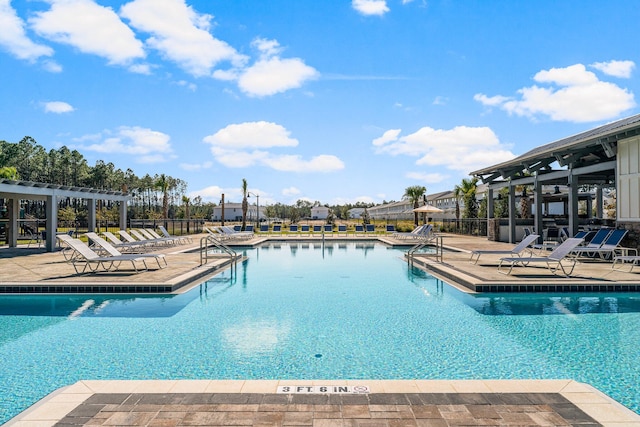 view of swimming pool featuring a pergola and a patio