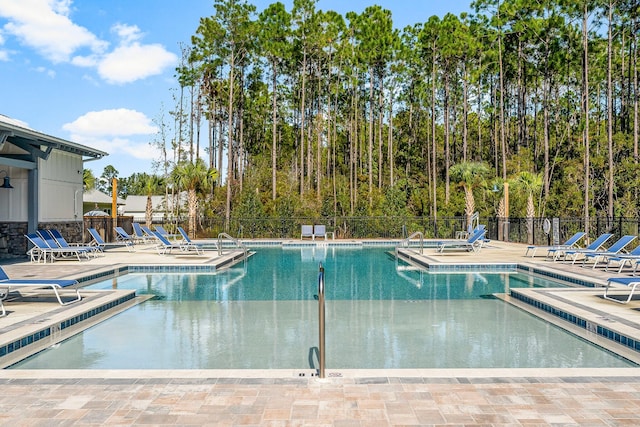 view of swimming pool featuring a patio