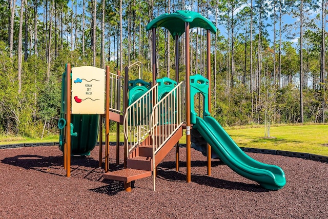 view of jungle gym featuring a lawn