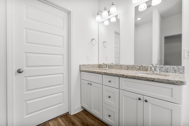 bathroom with vanity and hardwood / wood-style flooring