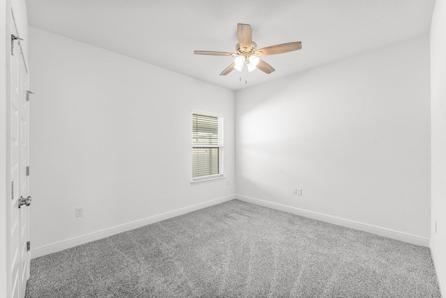 unfurnished room with ceiling fan and carpet floors