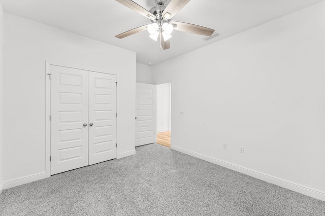 unfurnished bedroom featuring a closet and ceiling fan