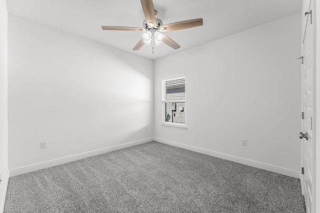 empty room with ceiling fan and carpet floors