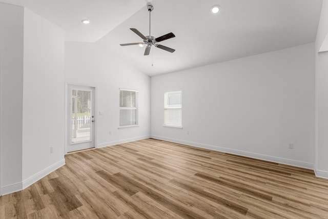 unfurnished room featuring ceiling fan, light hardwood / wood-style floors, and high vaulted ceiling