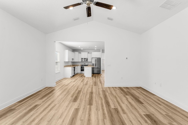 unfurnished living room with ceiling fan, vaulted ceiling, and light hardwood / wood-style flooring