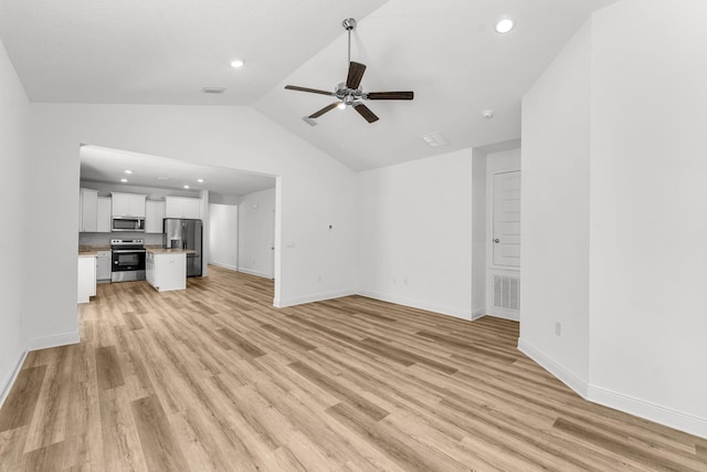 unfurnished living room featuring ceiling fan, light hardwood / wood-style flooring, and lofted ceiling