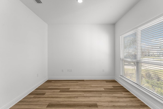 unfurnished room featuring wood-type flooring