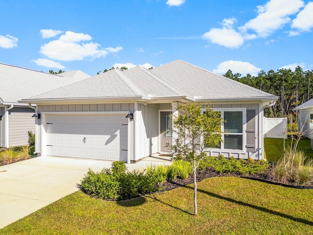 single story home featuring a garage and a front yard