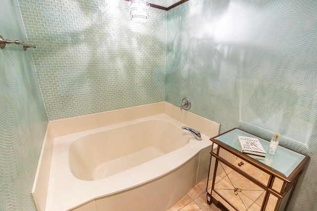 bathroom featuring tile patterned floors and a tub to relax in