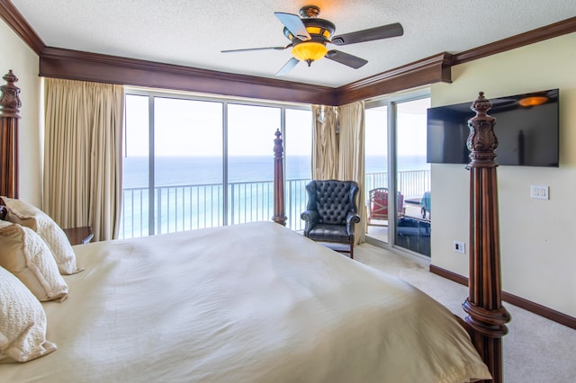 bedroom featuring access to exterior, ceiling fan, crown molding, light colored carpet, and a textured ceiling