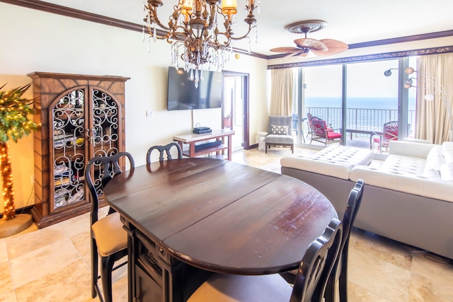 dining room with ceiling fan with notable chandelier and crown molding