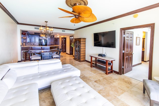 living room featuring crown molding and ceiling fan with notable chandelier