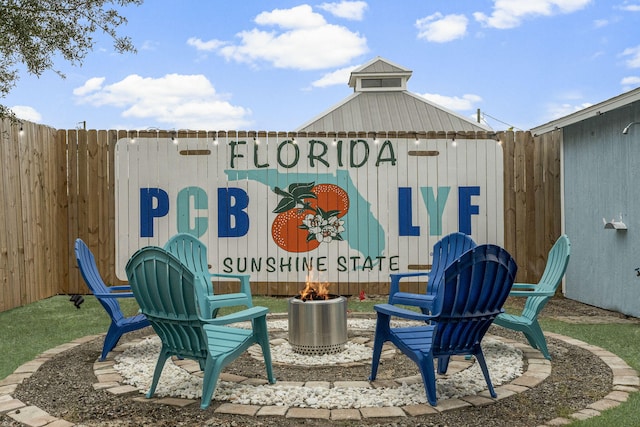 view of patio with a fire pit