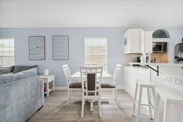 dining area featuring light wood-type flooring