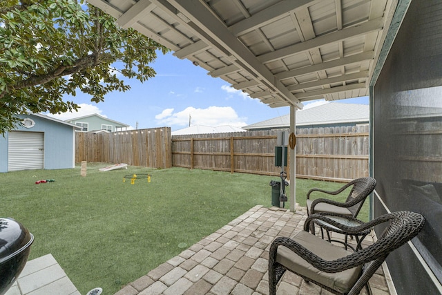 view of yard with a patio and a storage shed