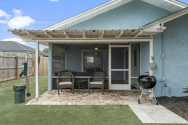 view of patio / terrace with a grill and a sunroom