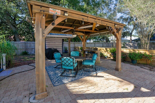 view of patio featuring a gazebo and area for grilling