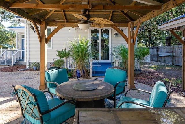 view of patio / terrace featuring a gazebo and ceiling fan