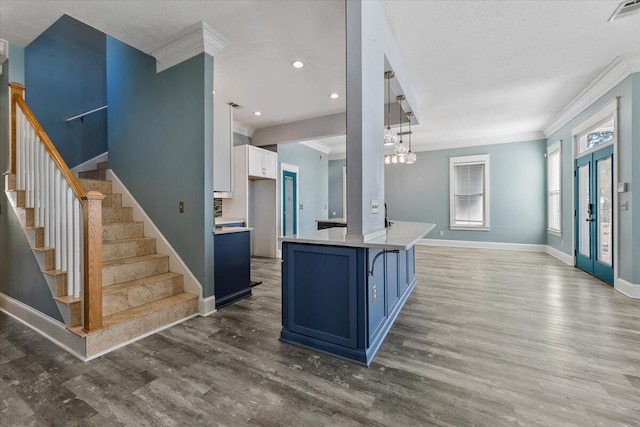 kitchen featuring french doors, white cabinets, blue cabinets, decorative light fixtures, and dark hardwood / wood-style flooring