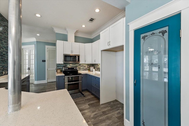 kitchen featuring white cabinetry, dark hardwood / wood-style floors, and appliances with stainless steel finishes