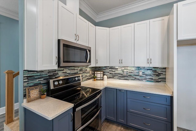 kitchen with decorative backsplash, stainless steel appliances, white cabinetry, and dark hardwood / wood-style floors