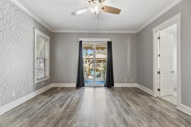 empty room with hardwood / wood-style flooring, ceiling fan, and ornamental molding