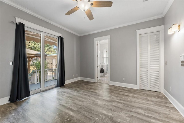 spare room featuring crown molding, light hardwood / wood-style flooring, and ceiling fan