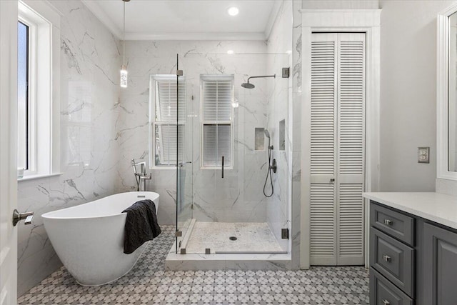 bathroom with vanity, separate shower and tub, ornamental molding, and tile walls