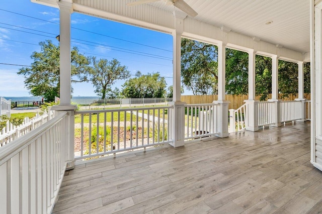 14138 State Highway 20, Niceville, FL 32578 - wooden terrace featuring ceiling fan, a fenced backyard, and a water view