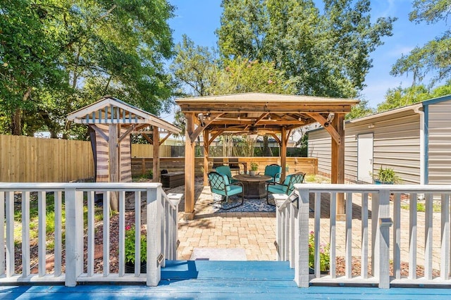 14138 State Highway 20, Niceville, FL 32578 - wooden terrace with a gazebo, a fenced backyard, and a patio area