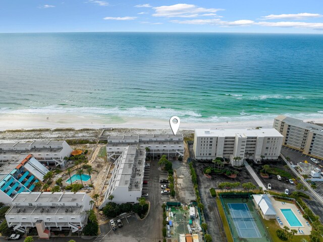 birds eye view of property featuring a water view and a view of the beach