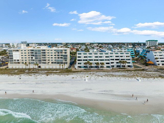 bird's eye view featuring a view of the beach and a water view