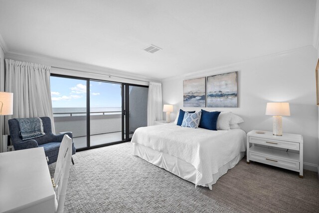 bedroom featuring access to outside, crown molding, a water view, and carpet