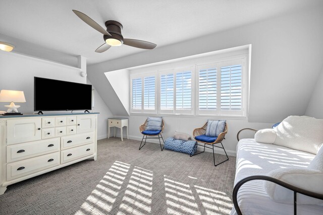 interior space with ceiling fan and light colored carpet