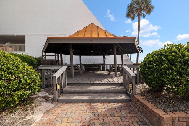 exterior space featuring a gazebo and a wooden deck