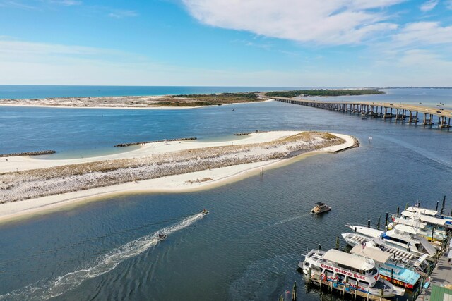 bird's eye view featuring a water view and a view of the beach