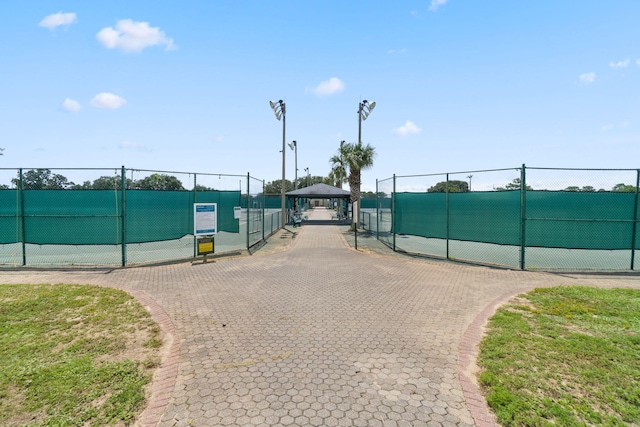 view of tennis court featuring a gazebo