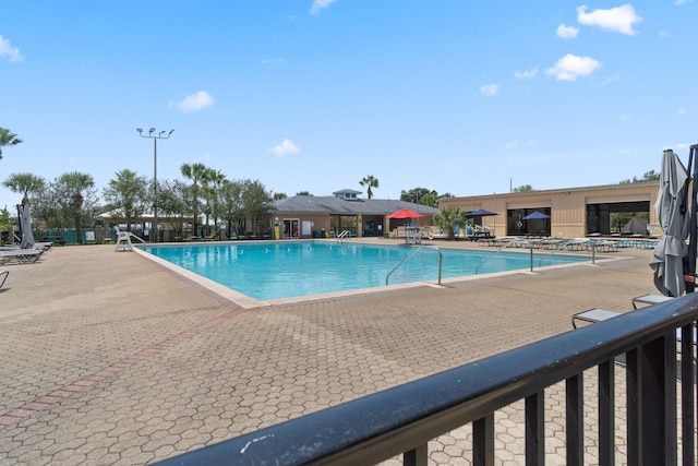 view of swimming pool featuring a patio area