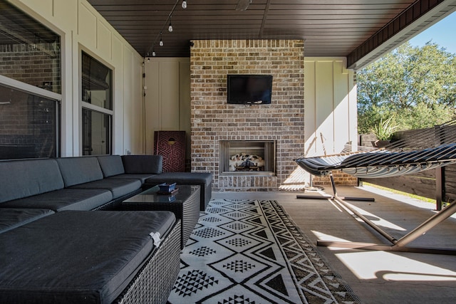 view of patio / terrace featuring an outdoor living space with a fireplace