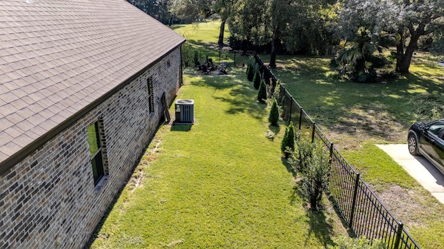 view of yard with central AC