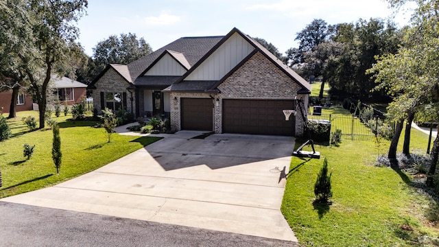 view of front of house featuring a garage and a front yard