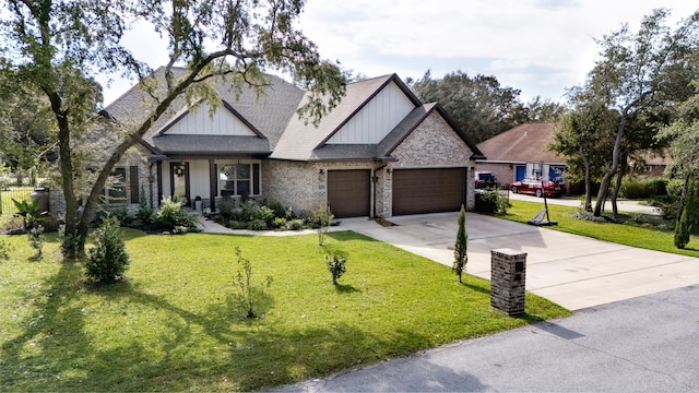 craftsman house featuring a garage and a front yard