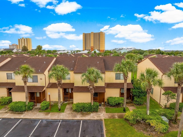 17751 Panama City Beach Pkwy Unit 13E, Panama City Beach, FL 32413 - view of property with uncovered parking and a residential view
