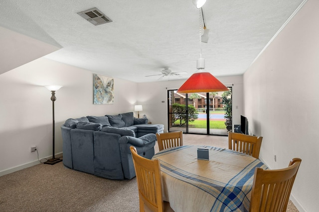 17751 Panama City Beach Pkwy Unit 13E, Panama City Beach, FL 32413 - dining space featuring a textured ceiling, ceiling fan, carpet floors, and baseboards