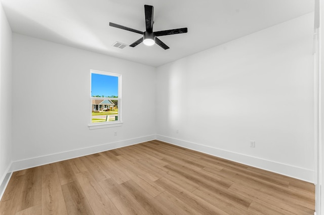 empty room with light hardwood / wood-style floors and ceiling fan