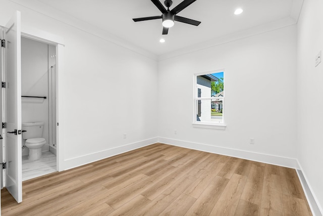 spare room with light wood-type flooring, ceiling fan, and crown molding