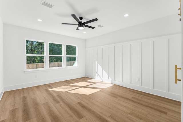 empty room featuring ceiling fan and light wood-type flooring