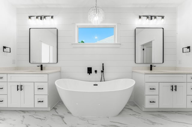 bathroom featuring a tub to relax in, wooden walls, vanity, and a chandelier