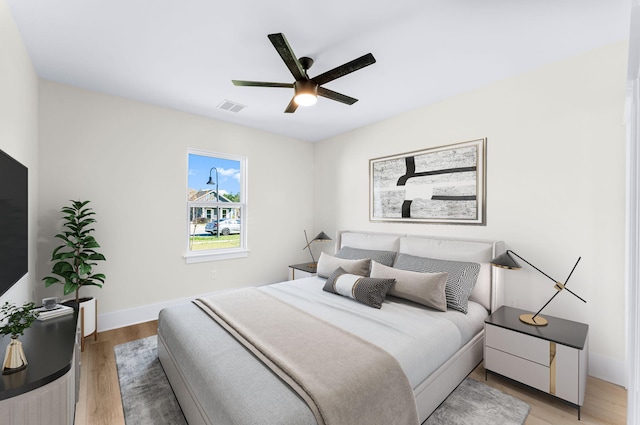 bedroom featuring hardwood / wood-style floors and ceiling fan