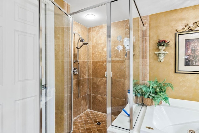 bathroom with shower with separate bathtub